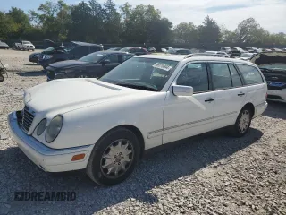 1999 Mercedes-Benz E-Class with VIN WDBJH65F1XA811693, listed as a Copart auction lot 69370604 with 128,876 mi miles and Salvage Title. Bid and sale history available at carsss.com. Image 1.