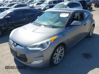 2013 Hyundai Veloster w/Black Int with VIN KMHTC6AD5DU095867, listed as a IAAI auction lot 42698380 with 115,528 mi miles and . Bid and sale history available at DreamBid. Image 2.