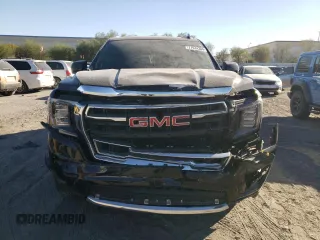 2022 GMC Yukon SLT with VIN 1GKS2BKD5NR356479, listed as a Copart auction lot 77674304 with 33,580 mi miles and Salvage Title. Bid and sale history available at carsss.com. Image 5.