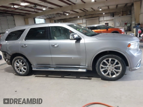 2016 Dodge Durango Citadel Anodized Platinum with VIN 1C4SDJET9GC459090, listed as a IAAI auction lot 41991478 with 115,924 mi miles and . Bid and sale history available at DreamBid. Image 14.
