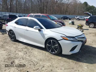 2020 Toyota Camry XSE with VIN 4T1K61AK8LU987937, listed as a IAAI auction lot 41604530 with 102,967 mi miles and . Bid and sale history available at DreamBid. Image 1.