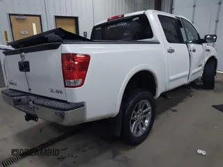 2014 Nissan Titan S with VIN 1N6AA0EC1EN504617, listed as a IAAI auction lot 41633861 with 65,047 mi miles. Bid and sale history available at carsss.com. Image 4.