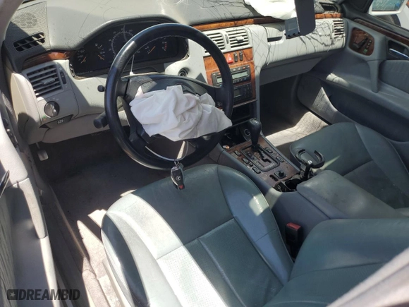 1999 Mercedes-Benz E-Class with VIN WDBJF70H5XA831773, listed as a Copart auction lot 71320244 with 145,181 mi miles and Salvage Title. Bid and sale history available at carsss.com. Image 8.