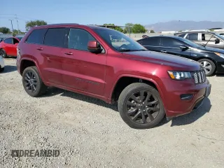 2020 Jeep Grand Cherokee Laredo E with VIN 1C4RJEAG2LC379633, listed as a Copart auction lot 58437555 with 57,219 mi miles and Salvage title. Bid and sale history available at DreamBid. Image 4.