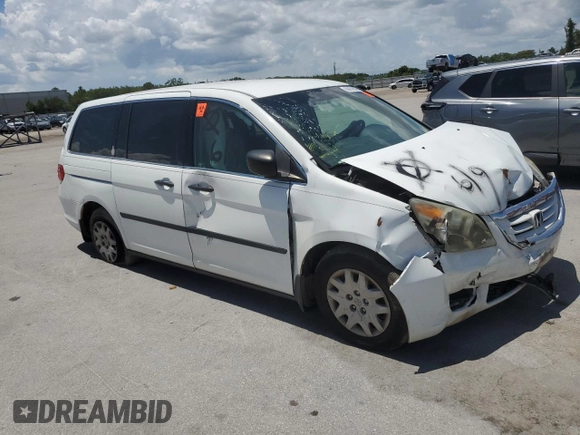 2010 Honda Odyssey LX with VIN 5FNRL3H23AB032112, listed as a Copart auction lot 60876035 with 223,335 mi miles and Salvage title. Bid and sale history available at DreamBid. Image 4.