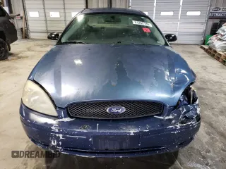 2004 Ford Taurus SE z VIN 1FAFP532X4A187754, wystawiony jako Copart lot #51262185 z przebiegiem 121 663 mil mil oraz Szkoda całkowita • Salvage title. Historia ofert i sprzedaży dostępna na DreamBid. Obrazek 5.