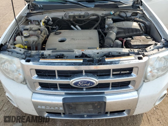 2012 Ford Escape Hybrid z VIN 1FMCU5K3XCKA58465, wystawiony jako Copart lot #75527194 z przebiegiem 263 996 mil mil oraz Szkoda całkowita • Salvage title. Historia ofert i sprzedaży dostępna na DreamBid. Obrazek 13.
