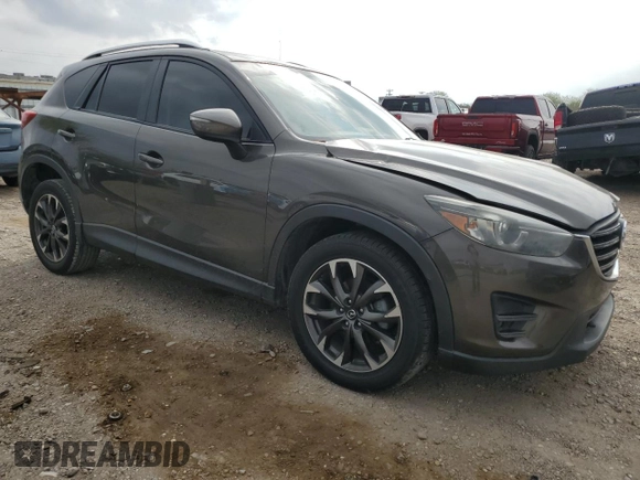 2016 Mazda CX-5 Grand Touring z VIN JM3KE2DY7G0735355, wystawiony jako Copart lot #49438285 z przebiegiem 132 731 mil mil oraz Szkoda całkowita • Salvage title. Historia ofert i sprzedaży dostępna na DreamBid. Obrazek 4.