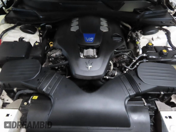 2014 Maserati Ghibli S Q4 z VIN ZAM57RTA7E1094580, wystawiony jako Copart lot #58866195 z przebiegiem 79 463 mil mil oraz Szkody całkowita. Historia ofert i sprzedaży dostępna na DreamBid. Obrazek 7.