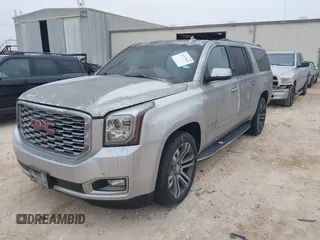 2019 GMC Yukon XL Denali with VIN 1GKS1HKJ0KR257673, listed as a IAAI auction lot 41375951 with 71,291 mi miles. Bid and sale history available at carsss.com. Image 2.