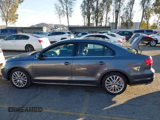 2015 Volkswagen Jetta Sport with VIN 3VWD17AJ2FM318669, listed as a IAAI auction lot 41266868 with 124,539 mi miles and . Bid and sale history available at DreamBid. Image 14.