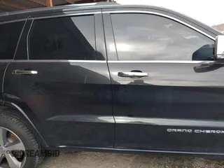 2015 Jeep Grand Cherokee Overland with VIN 1C4RJFCT4FC138404, listed as a IAAI auction lot 41188085 with 152,486 mi miles. Bid and sale history available at carsss.com. Image 14.