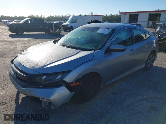 2020 Honda Civic LX with VIN 19XFC2F63LE004953, listed as a IAAI auction lot 41824922 with 71,458 mi miles and . Bid and sale history available at DreamBid. Image 17.