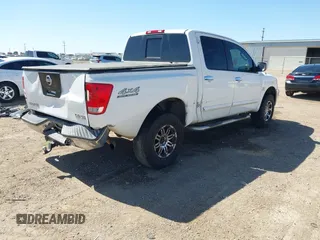 2004 Nissan Titan LE z VIN 1N6AA07B14N528418, wystawiony jako IAAI lot #42281318 z przebiegiem 200 902 mil mil oraz . Historia ofert i sprzedaży dostępna na DreamBid. Obrazek 4.