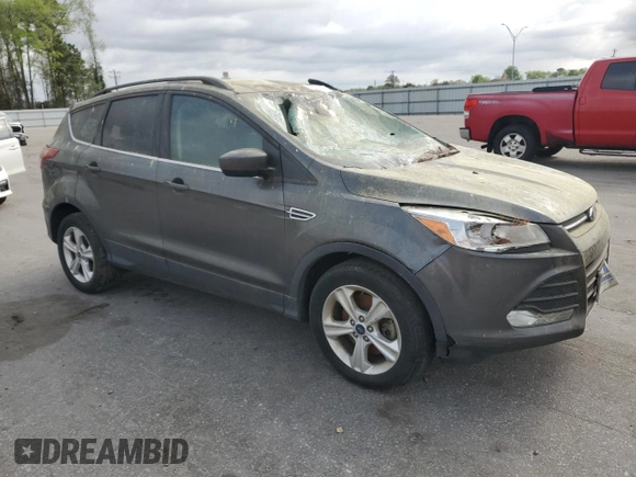2015 Ford Escape SE with VIN 1FMCU9GXXFUC72335, listed as a Copart auction lot 51114735 with 157,471 mi miles and Salvage Title. Bid and sale history available at DreamBid. Image 4.