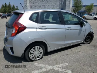 2015 Honda Fit LX with VIN 3HGGK5H55FM748370, listed as a Copart auction lot 61524455 with 87,235 mi miles and Salvage title. Bid and sale history available at DreamBid. Image 3.
