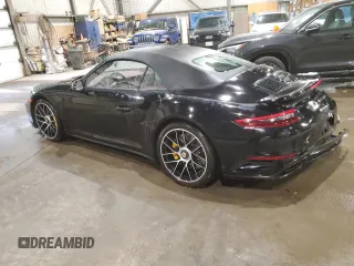 2019 Porsche 911 Turbo S with VIN WP0CD2A9XKS144611, listed as a Copart auction lot 77636924 with 62,657 mi miles and Salvage Title. Bid and sale history available at carsss.com. Image 2.
