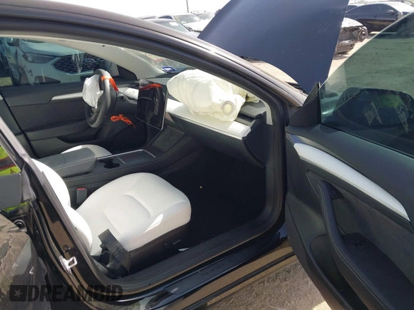 2023 Tesla Model 3 z VIN 5YJ3E1EA7PF465540, wystawiony jako IAAI lot #42261848 z przebiegiem 15 885 mil mil oraz . Historia ofert i sprzedaży dostępna na DreamBid. Obrazek 5.