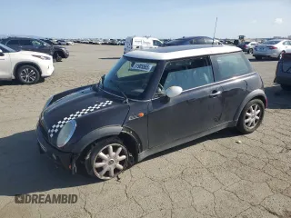 2004 MINI Hardtop with VIN WMWRC33464TJ62893, listed as a Copart auction lot 51905565 with 141,958 mi miles and Salvage Title. Bid and sale history available at DreamBid. Image 1.