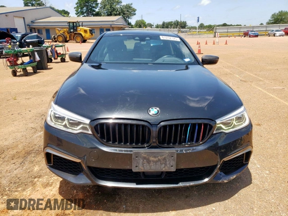 2018 BMW 5 Series M550i xDrive with VIN WBAJB9C54JB286450, listed as a Copart auction lot 61232125 with 88,479 mi miles and Salvage title. Bid and sale history available at DreamBid. Image 5.