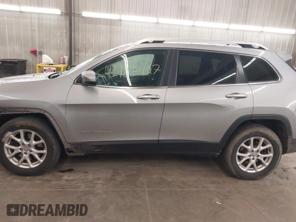 2014 Jeep Cherokee Altitude with VIN 1C4PJMCB9EW149754, listed as a IAAI auction lot 41983427 with 199,810 mi miles and . Bid and sale history available at DreamBid. Image 15.