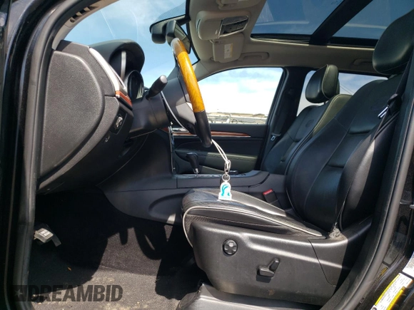 2013 Jeep Grand Cherokee Overland with VIN 1C4RJFCT2DC576125, listed as a Copart auction lot 52595165 with 100,361 mi miles and Salvage Title. Bid and sale history available at carsss.com. Image 7.