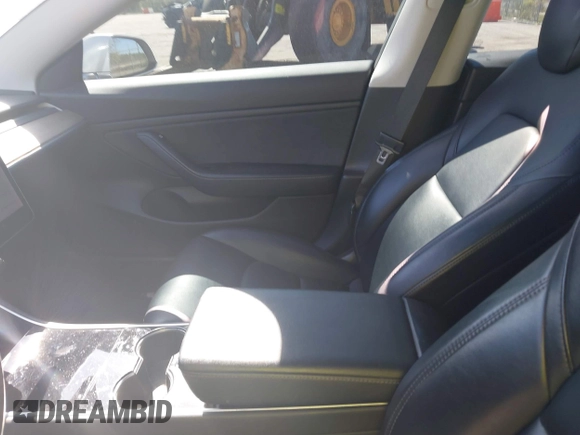 2019 Tesla Model 3 Mid Range with VIN 5YJ3E1EA7KF425127, listed as a IAAI auction lot 41886436 with 87,236 mi miles and . Bid and sale history available at carsss.com. Image 5.