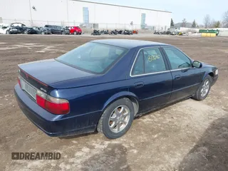 1999 Cadillac Seville Touring STS z VIN 1G6KY5493XU913994, wystawiony jako IAAI lot #41780695 z przebiegiem 60 375 mil mil oraz . Historia ofert i sprzedaży dostępna na DreamBid. Obrazek 4.