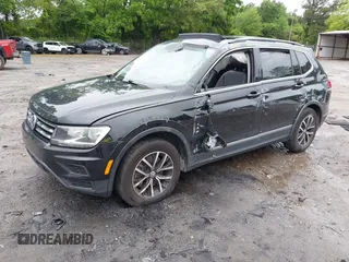 2021 Volkswagen Tiguan SE with VIN 3VV3B7AX6MM021502, listed as a IAAI auction lot 42243705 with 60,988 mi miles and . Bid and sale history available at DreamBid. Image 2.