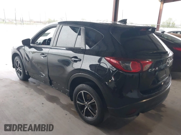 2016 Mazda CX-5 Touring with VIN JM3KE2CY2G0808424, listed as a IAAI auction lot 41880494 with 149,005 mi miles. Bid and sale history available at carsss.com. Image 3.