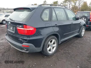 2008 BMW X5 3.0si with VIN 5UXFE43548L004975, listed as a IAAI auction lot 41563255 with 999,999 mi miles. Bid and sale history available at carsss.com. Image 4.