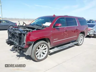2020 GMC Yukon XL Denali with VIN 1GKS1HKJ3LR238701, listed as a IAAI auction lot 41724274 with 107,323 mi miles and . Bid and sale history available at DreamBid. Image 2.