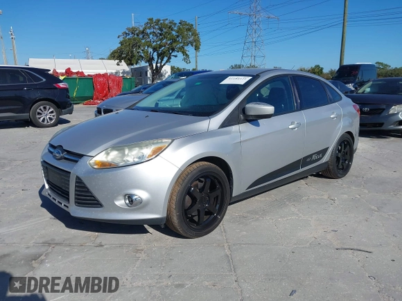 2012 Ford Focus SE with VIN 1FAHP3F23CL265724, listed as a IAAI auction lot 41184121 with 216,873 mi miles. Bid and sale history available at carsss.com. Image 2.