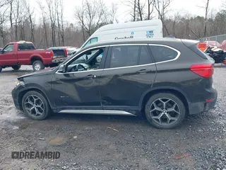2018 BMW X1 xDrive28i with VIN WBXHT3C34J5K31430, listed as a IAAI auction lot 41954792 with 125,447 mi miles. Bid and sale history available at carsss.com. Image 14.