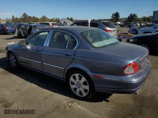 2004 Jaguar X-Type with VIN SAJEA51C04WD74995, listed as a Copart auction lot 77216404 with 87,853 mi miles and Clean Title. Bid and sale history available at carsss.com. Image 2.