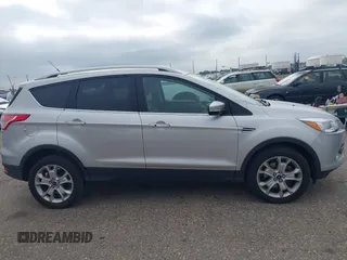 2016 Ford Escape Titanium with VIN 1FMCU9JX3GUC86930, listed as a IAAI auction lot 42582263 with 113,386 mi miles and . Bid and sale history available at DreamBid. Image 13.