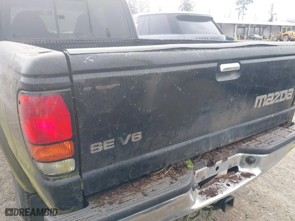 1999 Mazda B-Series 4WD Truck SE with VIN 4F4ZR17X5XTM17667, listed as a IAAI auction lot 41896804 with NaN miles. Bid and sale history available at carsss.com. Image 6.
