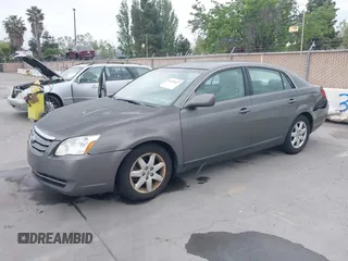 2007 Toyota Avalon XL with VIN 4T1BK36B47U175248, listed as a IAAI auction lot 42126427 with 144,284 mi miles. Bid and sale history available at carsss.com. Image 2.