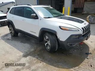 2015 Jeep Cherokee Trailhawk with VIN 1C4PJMBS8FW717950, listed as a Copart auction lot 60321625 with 155,210 mi miles and Salvage title. Bid and sale history available at DreamBid. Image 4.