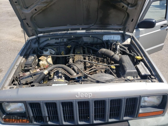 2000 Jeep Cherokee with VIN 1J4FN28S6YL210944, listed as a Copart auction lot 65163475 with 147,609 mi miles and Salvage title. Bid and sale history available at DreamBid. Image 12.