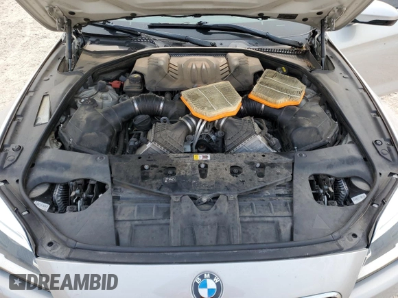 2017 BMW M6 z VIN WBS6E9C56HG437374, wystawiony jako Copart lot #54277624 z przebiegiem 80 858 mil mil oraz . Historia ofert i sprzedaży dostępna na DreamBid. Obrazek 11.