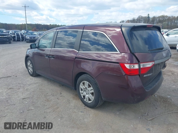 2013 Honda Odyssey LX with VIN 5FNRL5H28DB058401, listed as a IAAI auction lot 42050892 with 221,016 mi miles and . Bid and sale history available at carsss.com. Image 3.