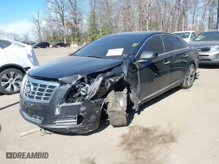 2013 Cadillac XTS Luxury with VIN 2G61R5S33D9184878, listed as a IAAI auction lot 41644213 with 113,293 mi miles. Bid and sale history available at carsss.com. Image 2.