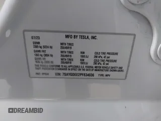 2023 Tesla Model Y Long Range z VIN 7SAYGDEE2PF834036, wystawiony jako IAAI lot #41933120 z przebiegiem 27 872 mil mil oraz . Historia ofert i sprzedaży dostępna na DreamBid. Obrazek 9.