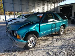 1995 GMC Jimmy SLS Base with VIN 1GKCS18WXS2519056, listed as a Copart auction lot 79313514 with 161,002 mi miles and Salvage Title. Bid and sale history available at carsss.com. Image 1.