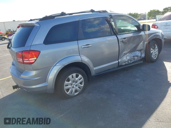 2016 Dodge Journey SE with VIN 3C4PDCAB2GT194810, listed as a IAAI auction lot 41559149 with 104,551 mi miles and . Bid and sale history available at DreamBid. Image 4.