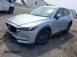 2020 Mazda CX-5 Touring with VIN JM3KFACM9L0785464, listed as a IAAI auction lot 42023311 with 90,062 mi miles and . Bid and sale history available at DreamBid. Image 17.
