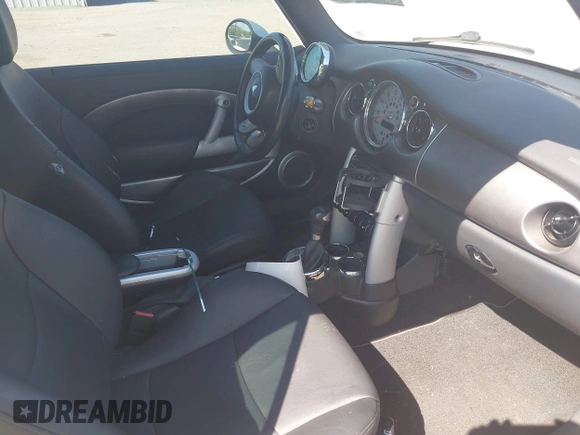 2006 MINI Convertible S with VIN WMWRH33596TK59633, listed as a IAAI auction lot 42242545 with 77,837 mi miles and . Bid and sale history available at DreamBid. Image 5.