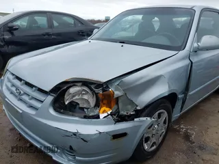 2003 Hyundai Accent GL with VIN KMHCG35C23U264360, listed as a IAAI auction lot 42033316 with 100,991 mi miles. Bid and sale history available at carsss.com. Image 6.