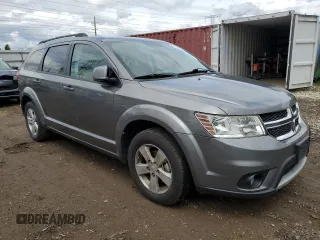 2012 Dodge Journey SXT z VIN 3C4PDCBG3CT213515, wystawiony jako Copart lot #58128845 z przebiegiem 208 152 mil mil oraz Szkoda całkowita • Salvage title. Historia ofert i sprzedaży dostępna na DreamBid. Obrazek 4.